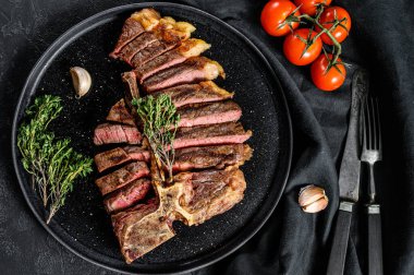 Grilled Porterhouse steak on a chopping Board. Cooked beef meat. White wooden background. Top view. clipart