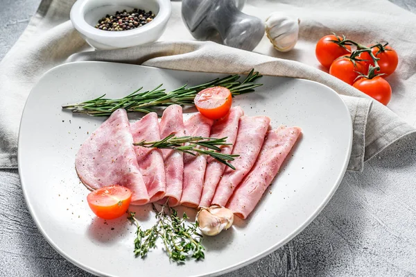 Cutted pork Ham Sausage. Traditional German boiled ham. Gray background. Top view.