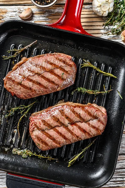 Ready to eat steak Top Blade beef breeds, black Angus meat. Gray background. Top view.