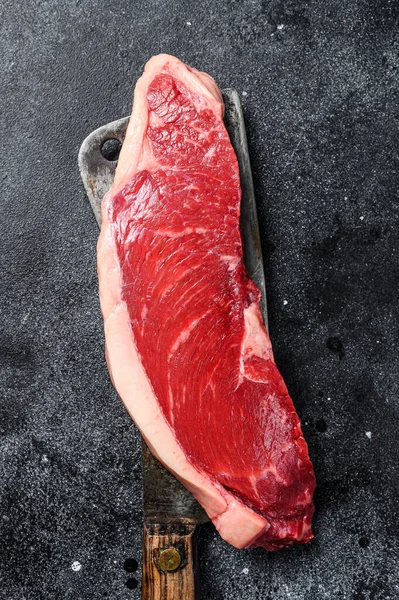 Raw marbled beef steak. black Angus meat. Black background. Top view.