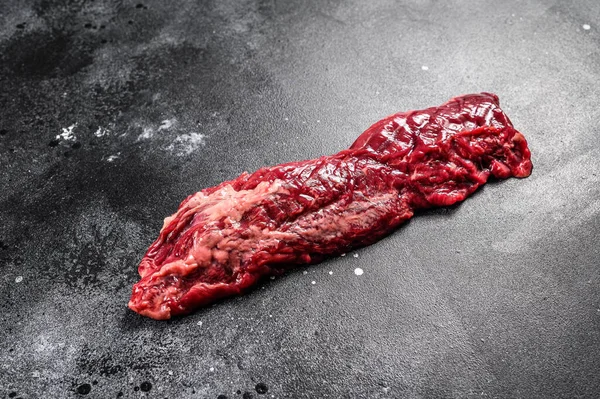Raw top blade, Denver steak. Black background. Top view