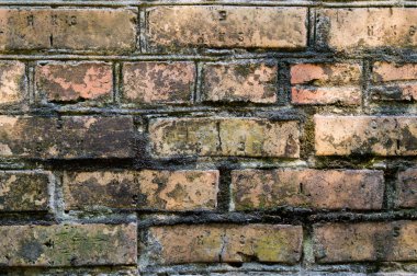 Eski kırmızı tuğla. Tuğla. Eski tuğla işi. Duvar kırmızı tuğladan yapılmıştır. Mimari doku.