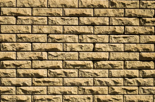 Masonry. Old masonry. The wall is built of stone. Architectural texture. Building stone.