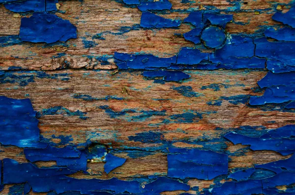 Texture of an old, damaged paintwork on wood. The texture of the old wood.