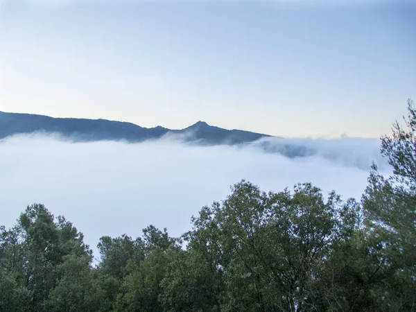 Mountains with fog at sunrise