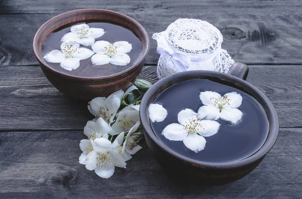 Jasmine tea with jasmine flowers on a dark background — Stock Photo, Image