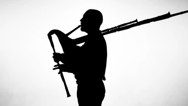 Black Silhouette White Background Man Playing Bagpipes National Ethnic Instrument — Stock Video