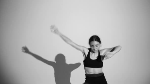 Young Ballerina Dancing Contemporary Dance Isolated Shadow Repeats Her Movements — Stock Video