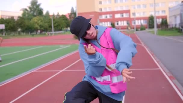 Young Girl Tracksuit Hat Dancing Street Dance Stadium Concept Improving — Stock Video