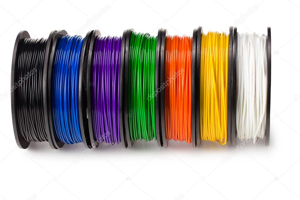 Black, blue, green, violet, orange, yellow, white filament for 3d printer isolated on white background