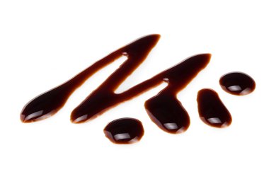 Dökülmüş soya souse teriyaki dokusu. Beyaz arka planda istiridye sosu veya balzamik sirke birikintileri