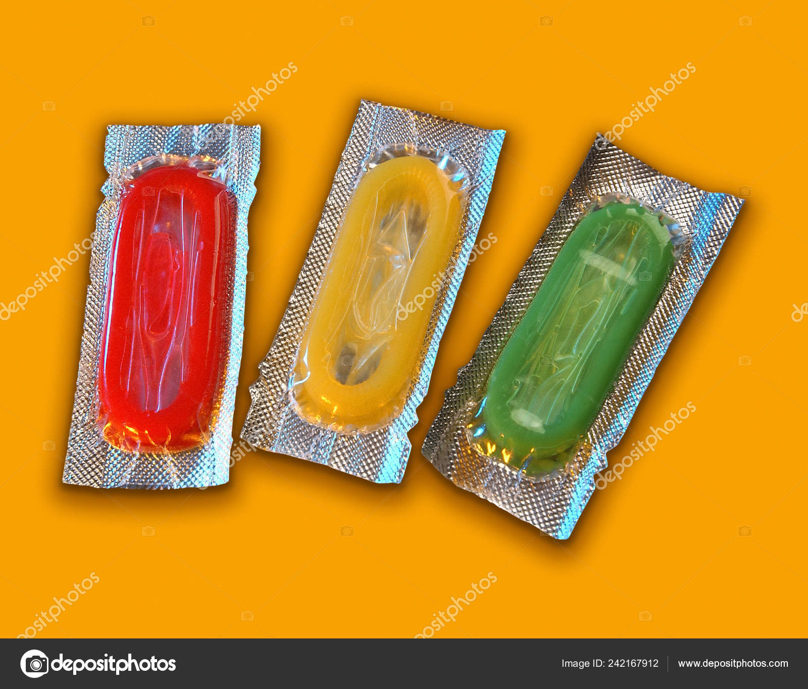 Download Red Yellow Green Condoms Foil Wrappers Yellow Background Stock Photo C Danjmh 242167912 PSD Mockup Templates