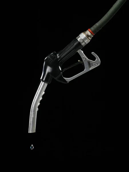 GAS PUMP WITH SINGLE DROP OF FUEL ON BLACK BACKGROUND — Stok Foto