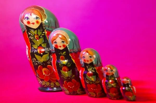 RUSSIAN DOLLS ON RED BACKGROUND