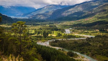Landscape of Blue river, valley and forest in El Bolson, argentinian Patagonia clipart