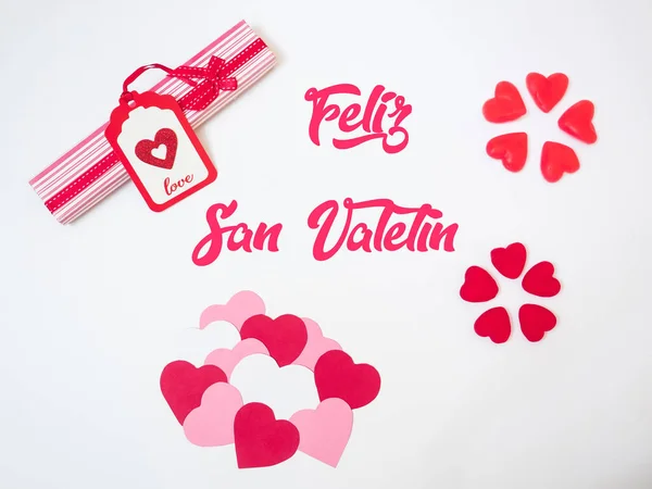 San Valentines hearts decorations made with red and pink papers and jelly beans and gummies. Valetines day