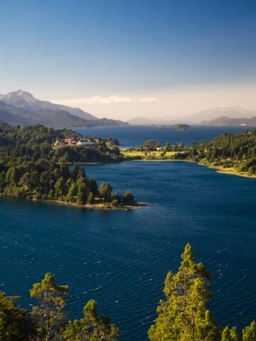 Argentine Lake District at sunrise view of the Llao Llao hotel a clipart