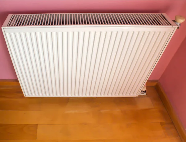 Modern radiator on color wall indoors. Central heating system — Stock Photo, Image