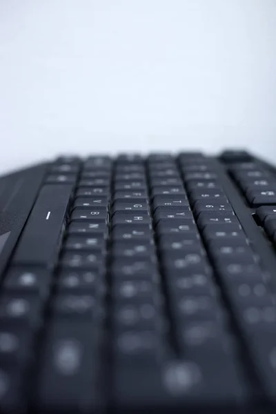 black computer wired keyboard button