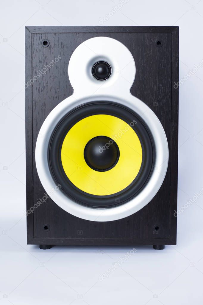 big subwoofer with yellow speaker on white background,loud music