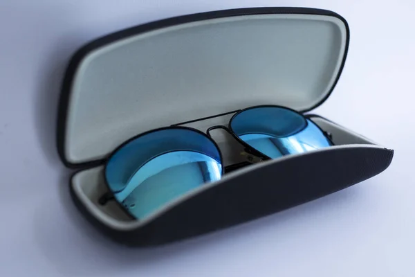 Blue mirrored sunglasses in a case — Stock Photo, Image