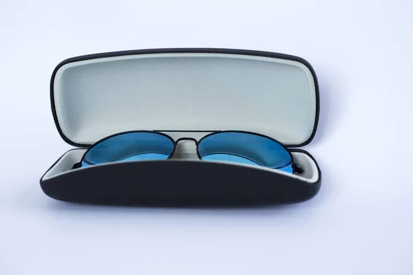 Blue mirrored sunglasses in a case — стоковое фото