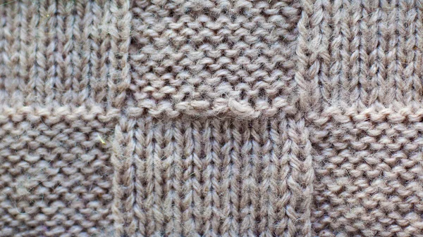 Серый фон вязаной пряжи, текстура трикотажной ткани — стоковое фото
