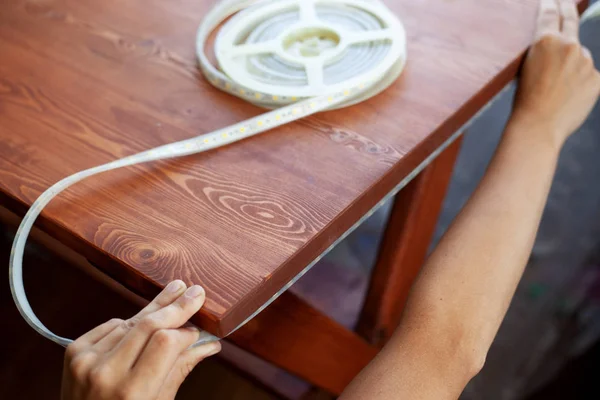 installing led strip lighting for under wooden table