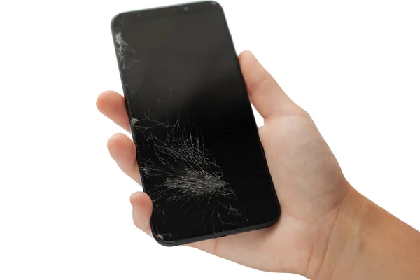 Черный сломанный телефон в руке на белом фоне взломанный сенсорный экран изолировать — стоковое фото