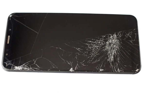 Svart telefon med en trasig sensor och skärm, knäckt pekskärm glas på en vit bakgrund isloate — Stockfoto