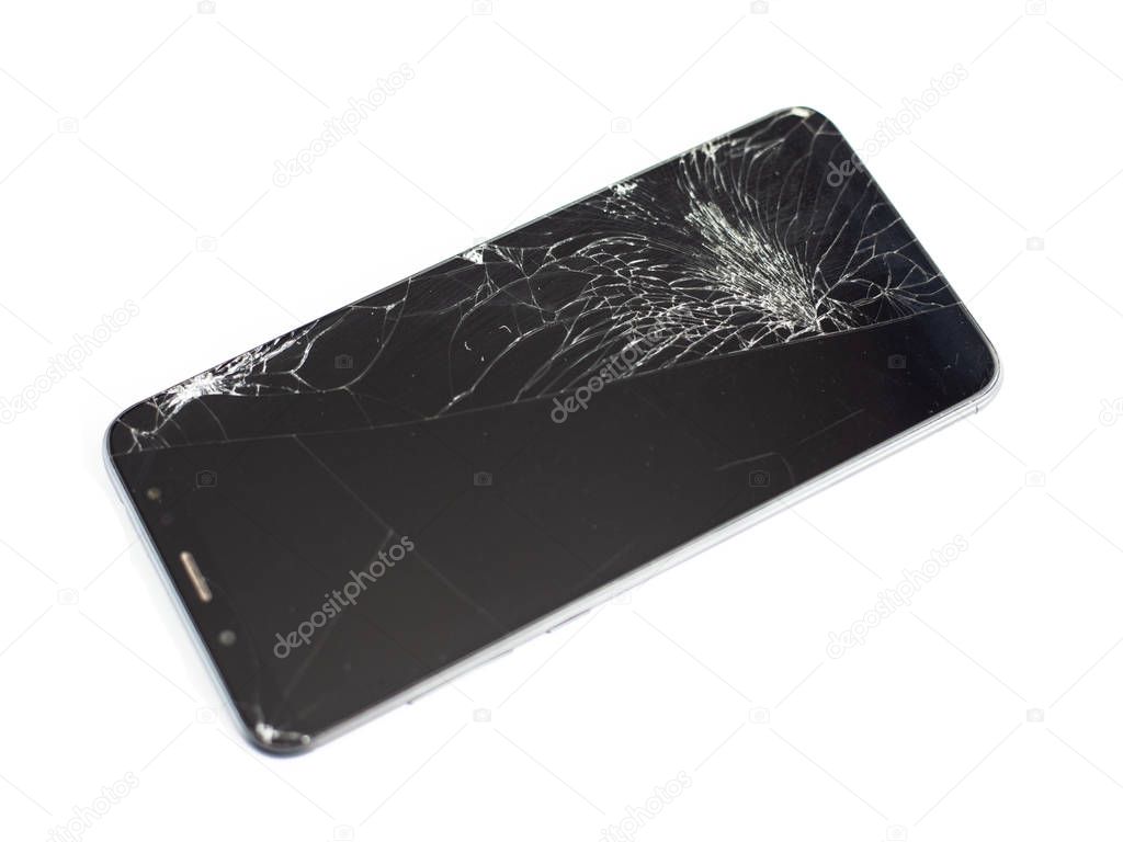 black phone with a broken sensor and screen, cracked touchscreen glass on a white background isloate
