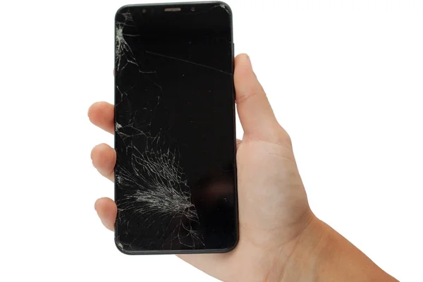 Черный сломанный телефон в руке на белом фоне взломанный сенсорный экран изолировать — стоковое фото