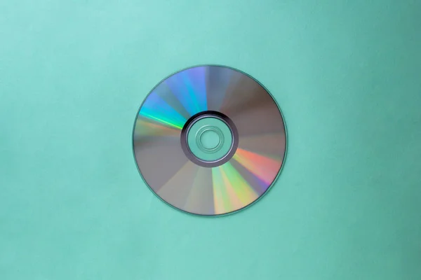 Cd compact disc on a aquamarine background top view  with copy space — Stock Photo, Image
