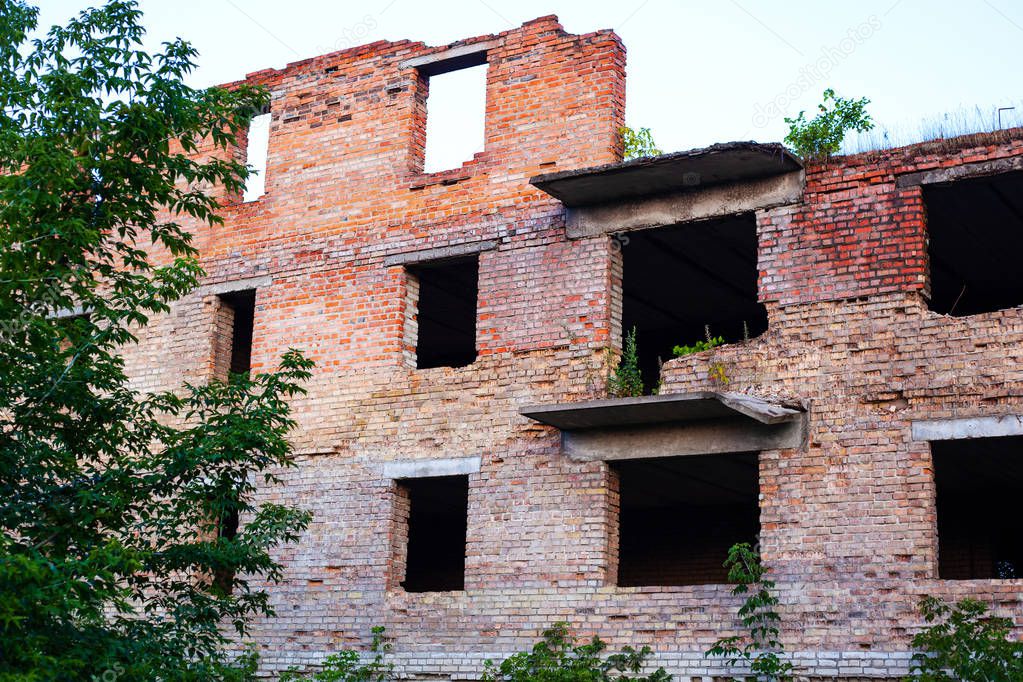 a school in the Donbass fired upon and destroyed by heavy weapons and damaged by an explosion of a red brick building