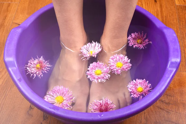 Beauty flowers in the bath for rejuvenating and healing feet