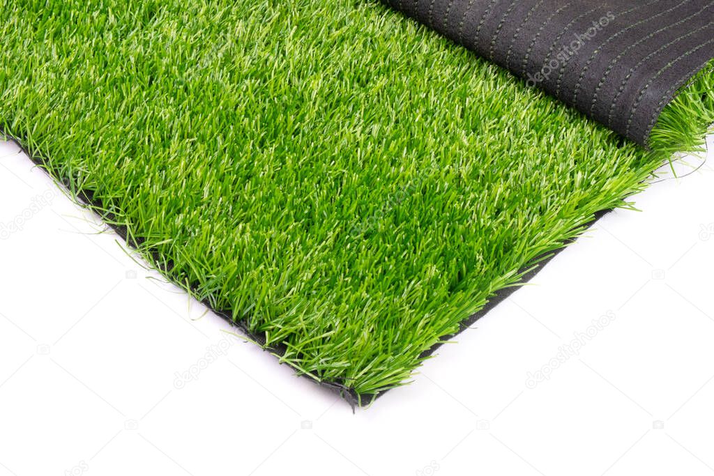 plastic green grass isolated on white background close up