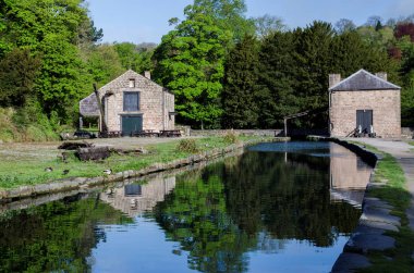 Old buildings at the side of Cromford Canal in the Peak District, Derbyshire clipart