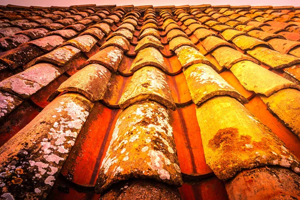 Old and ruined roofs. Texture of a roof with old roof tiles.