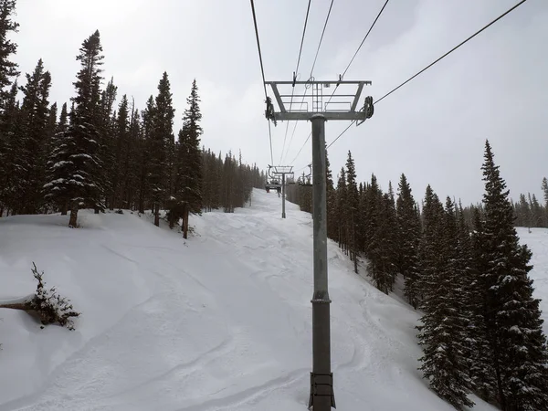 Ski lift and ski run in winter.