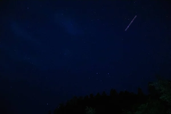 With 4 second exposure we can see the airplane trai