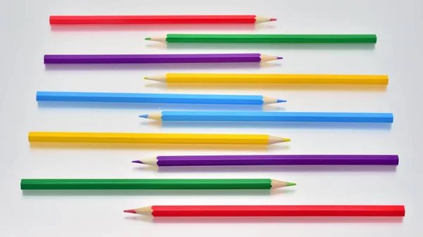 Colored Pencils Intertwined White Background — Stock Photo, Image