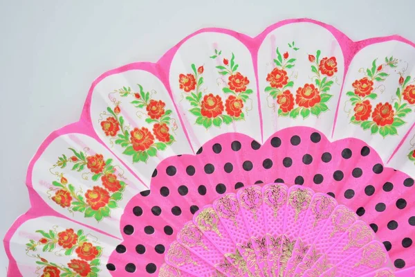 Typical Andalusian hand fan with flamenco motifs