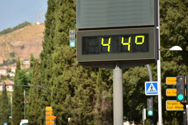 Street thermometer on a street marking 44 degrees Celsius