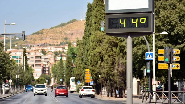 Street thermometer on a street marking 44 degrees Celsius