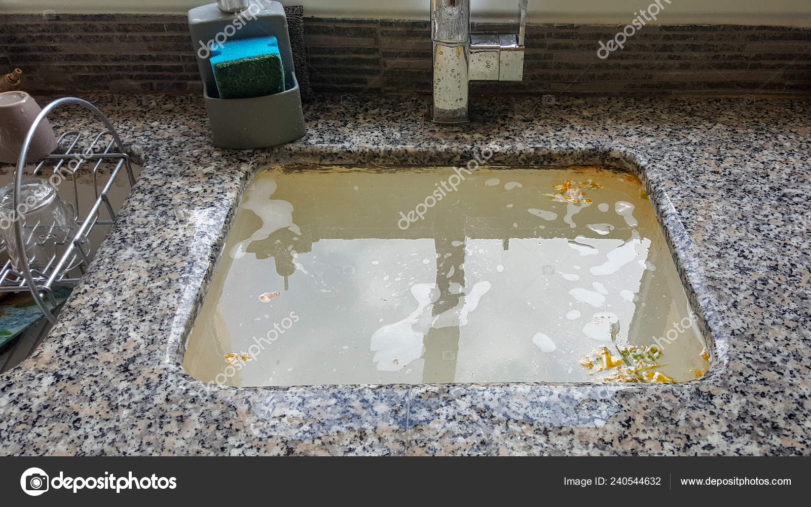 https://st4.depositphotos.com/22682272/24054/i/1600/depositphotos_240544632-stock-photo-overflowing-kitchen-sink-clogged-drain.jpg