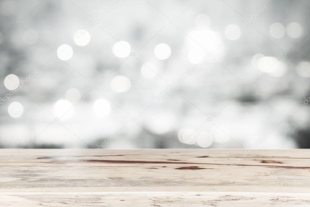 Empty wood table top for show product with blurred light bokeh background. Picture for add text message. Backdrop for design art work.