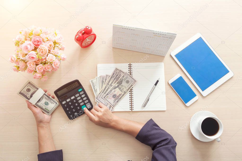 Closeup of business woman using calculator for working in office. Concept finance and accounting.