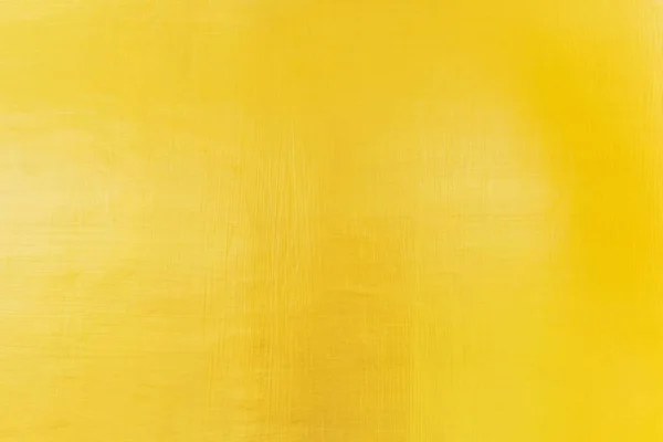 Abstract background from gold wall with sunlight.