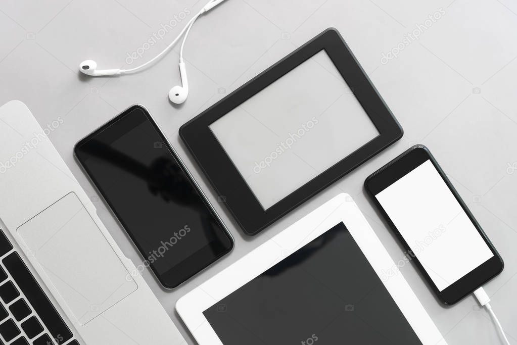 Modern technology devices on table in office. Mockup many size o