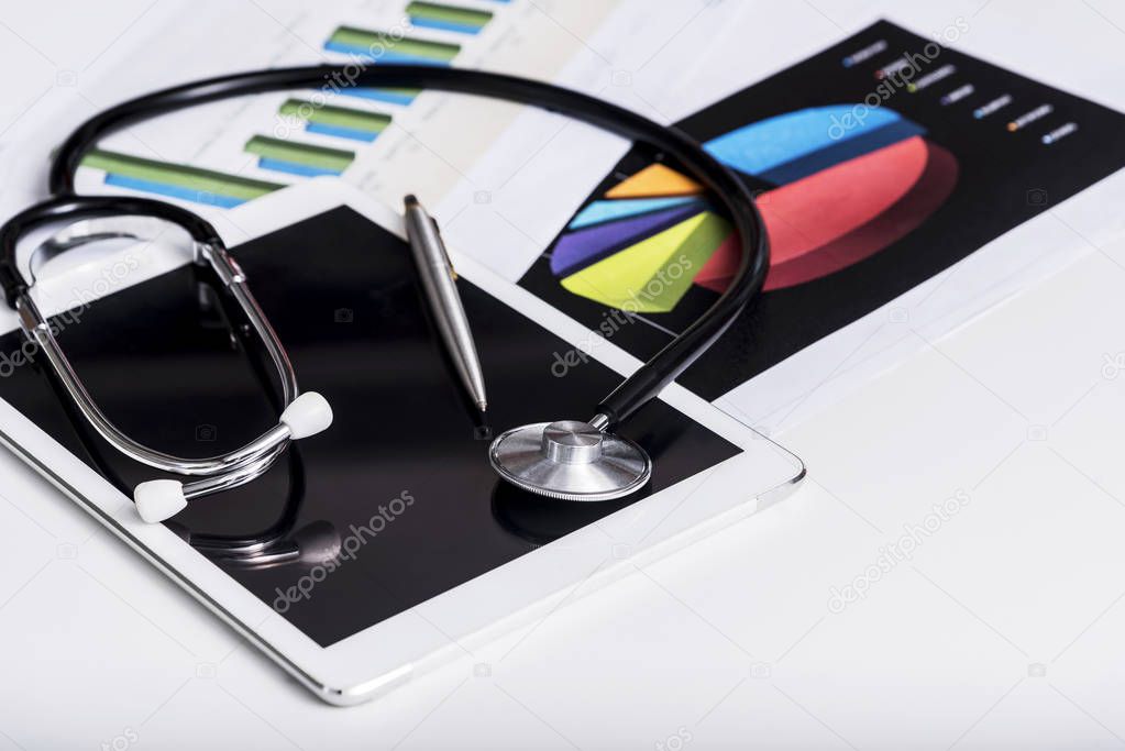 Healthcare and business concept. Stethoscope  on tablet with rep